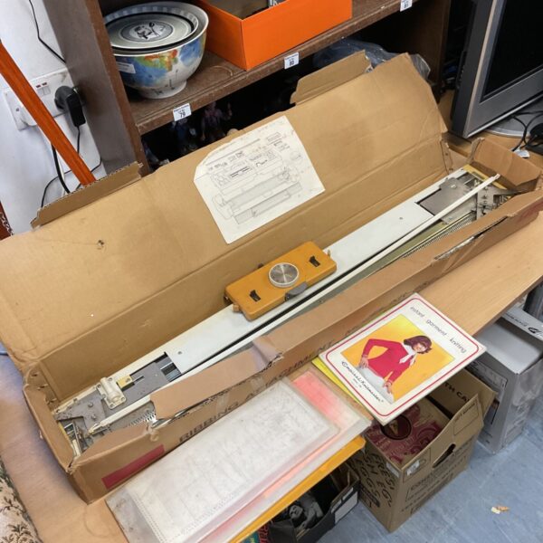 Vintage Brother knitting machine ribbing attachment in original box.