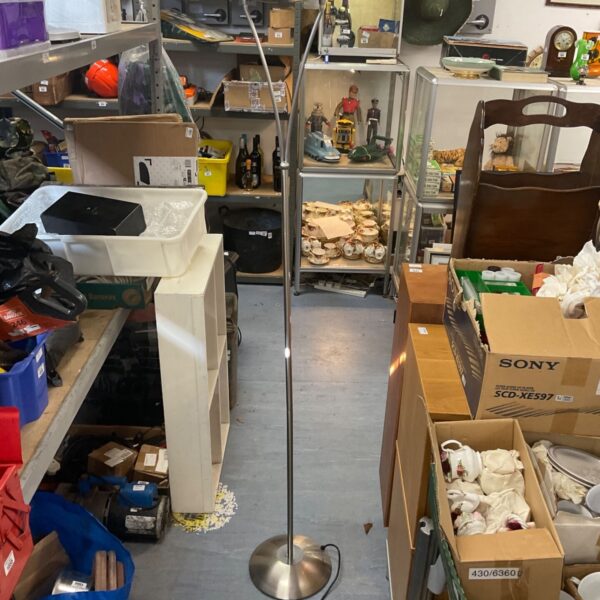 Brushed steel floor standing uplighter with circular base and dish-shaped head