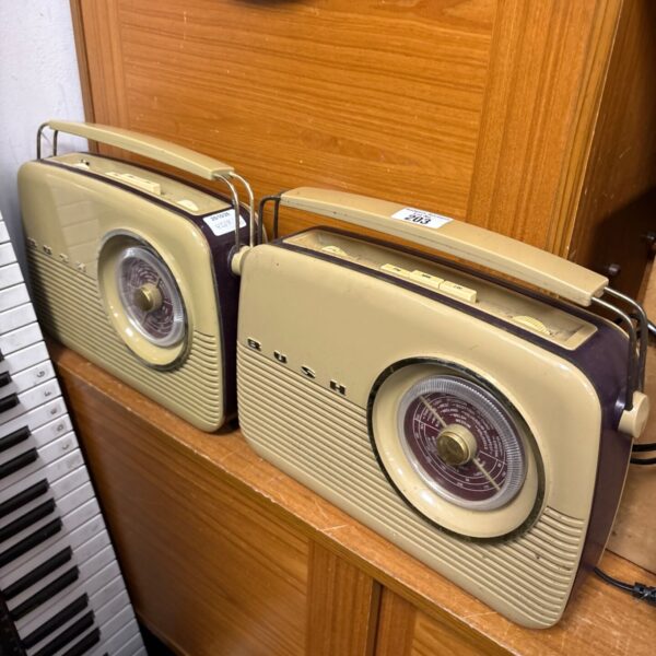 Pair of vintage Bush TR82/97 portable transistor radios in cream and maroon