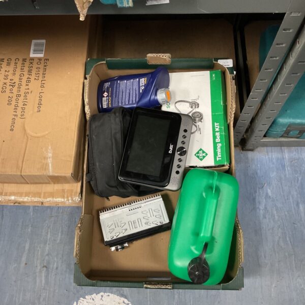 Car radio and timing belt kit in a cardboard box.