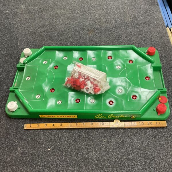 Vintage Casdon football tabletop game with red and white players.