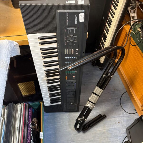 Vintage Casio CT-420 keyboard with keys and controls visible.