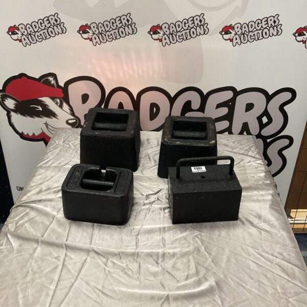 Four black cast iron grip handle test weights and calibration block weights