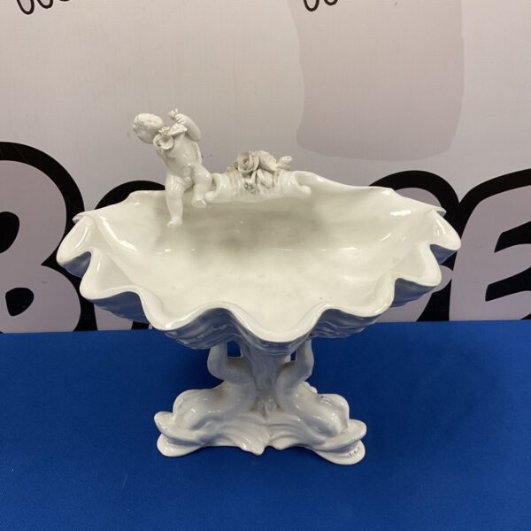 Vintage white ceramic compote bowl with cherub detail.