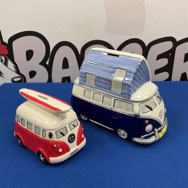 Two ceramic VW campervan moneyboxes in red surf and blue camper designs