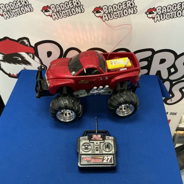Red Chevrolet SSR RC truck with remote control.