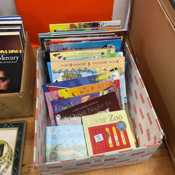 Stack of vintage childrens books, colourful illustrations, collectible storybooks.