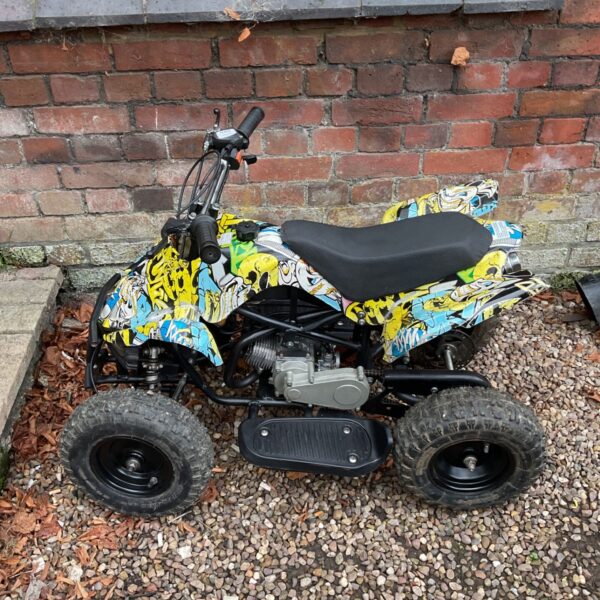 Colourful child's quad bike for off-road adventures.