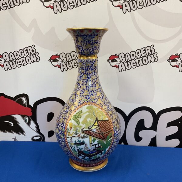 Antique Chinese ceramic vase with blue and white floral design.