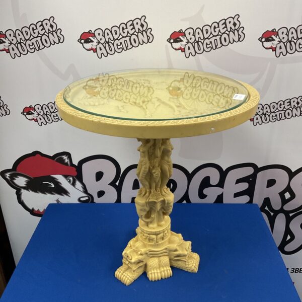 Ornate Chinese wine table with glass top and dragon claw base.