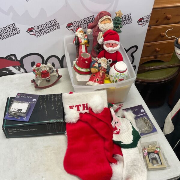 Collection of Christmas decorations with porcelain Santa figure, stockings and LED lights