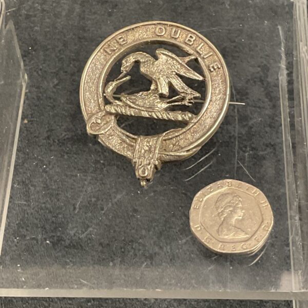 Vintage Clan Graham crest brooch with falcon emblem.