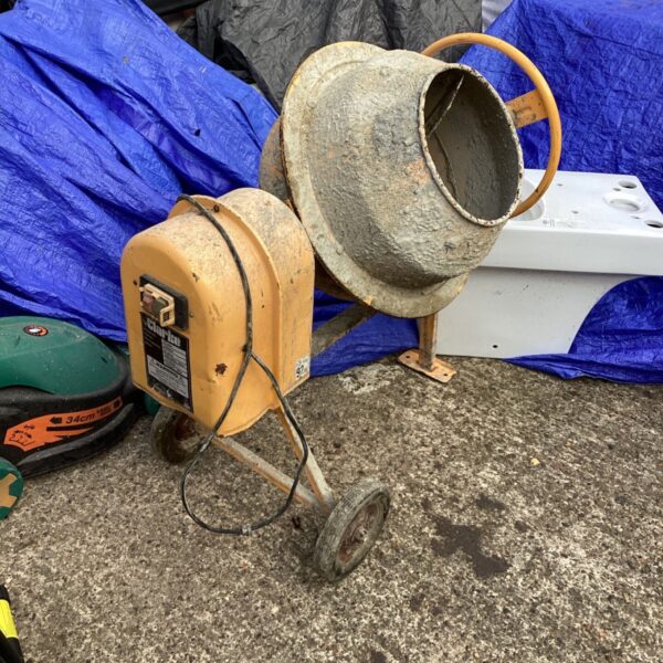 Yellow Clarke electric cement mixer for concrete and cement.