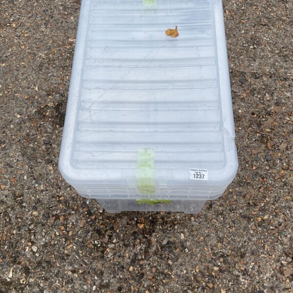 Clear plastic storage container for home organization.