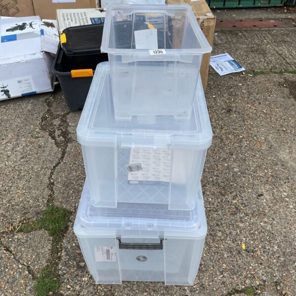 Clear plastic storage containers stacked for household organisation.