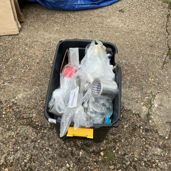 Black bin filled with a clearance lot of assorted items and return stock.