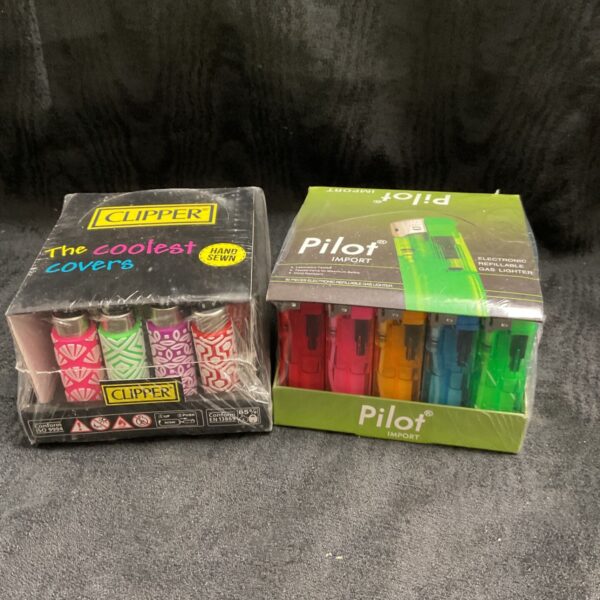Sealed packs of Clipper and Pilot gas lighters for collectors.