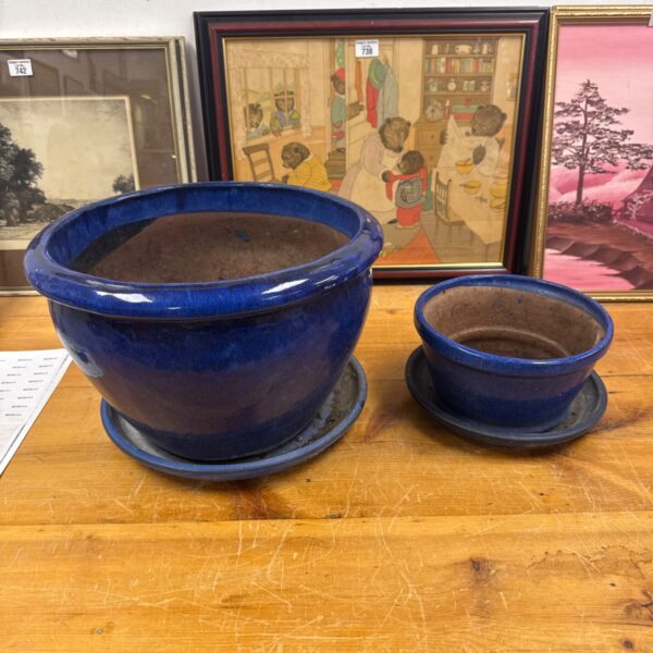 Vintage cobalt blue garden planters with saucers, classic garden decor.