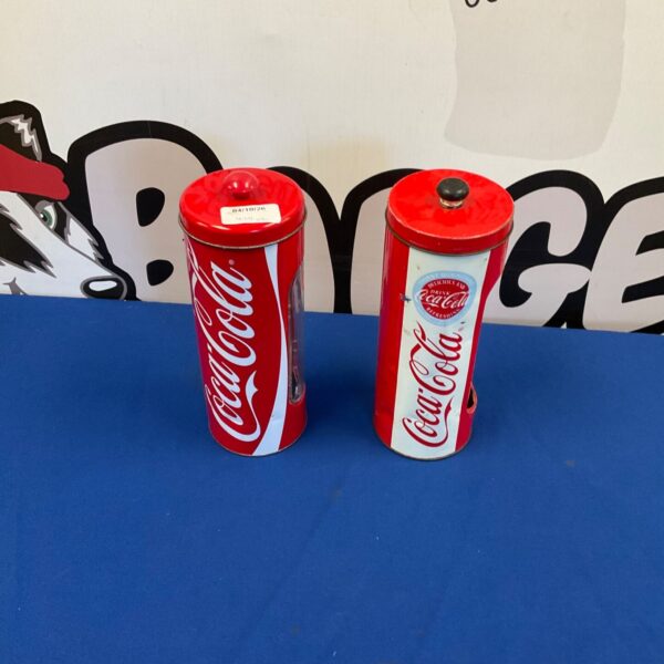 Vintage Coca Cola straw holders, red and white, collectible diner item.