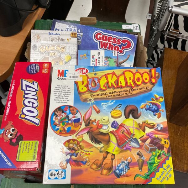 Collection of board games including Buckaroo, Zingo and Guess Who boxes