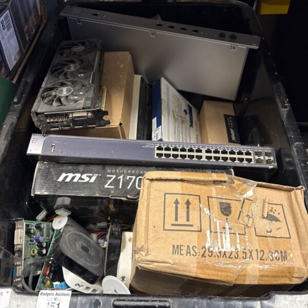 Crate of mixed computer parts including MSI motherboard box and network switch