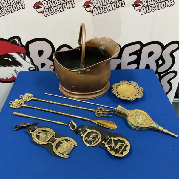 Antique copper helmcoal scuttle with brassware, vintage fireplace accessory.