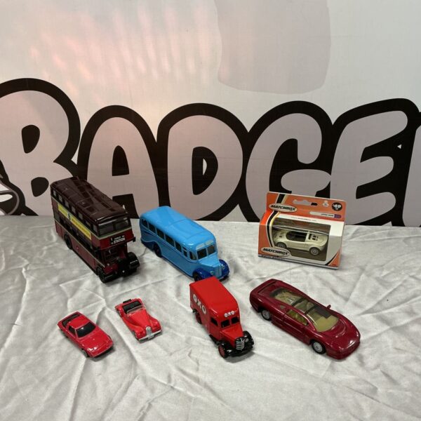 Corgi double-decker bus, coach, OXO van and Matchbox models displayed together