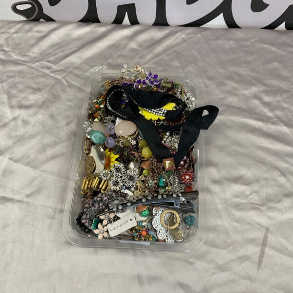 Clear tray of mixed costume jewellery with brooches, necklaces and hair clips