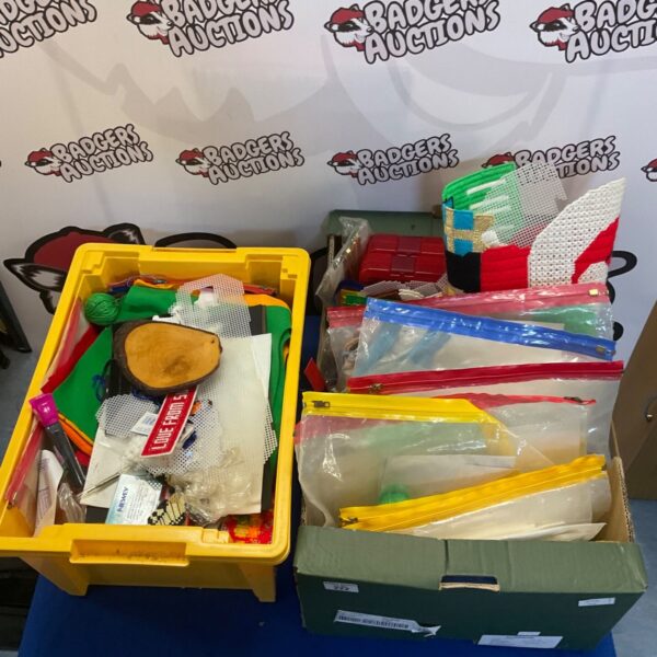 Assorted craft materials in two boxes, ideal for hobby projects.