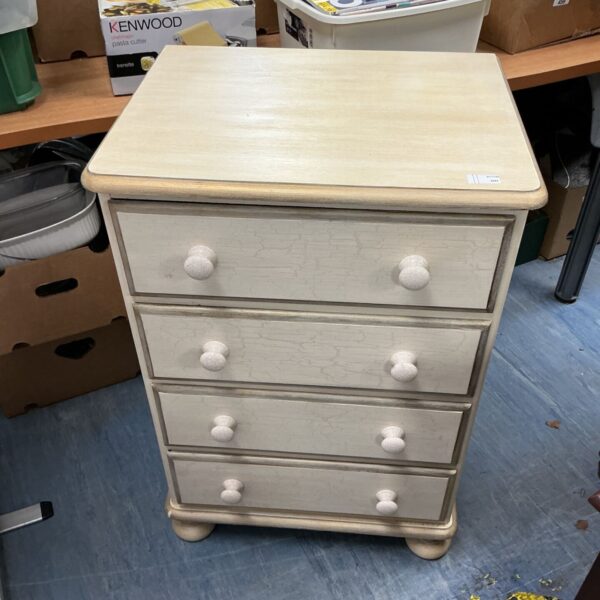 Cream painted four drawer chest with crackle finish and ceramic knobs