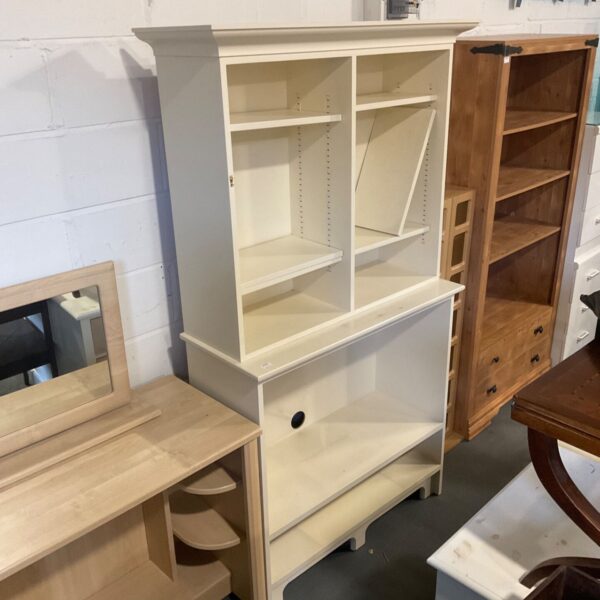 Cream painted wooden media cabinet with open shelves and moulded top