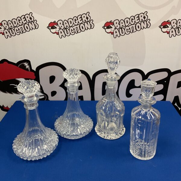 Set of four vintage lead crystal cut glass decanters.
