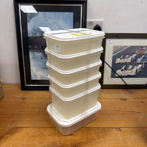 Set of six Curver food storage tubs for kitchen organisation.