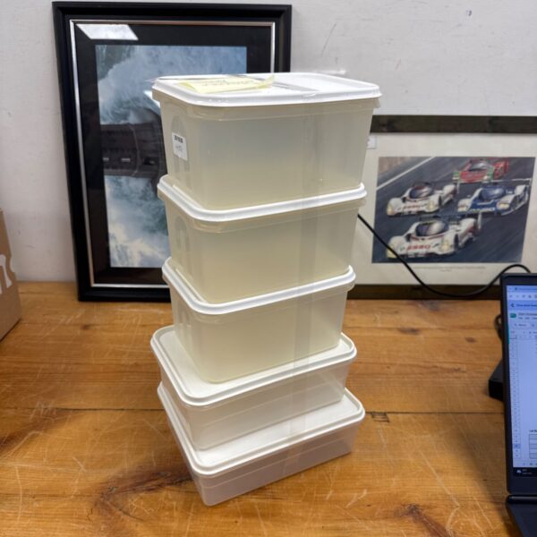 Set of six Curver food storage tubs for kitchen organisation.