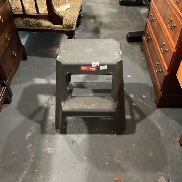 Black Curver two step utility ladder with textured treads and red branding
