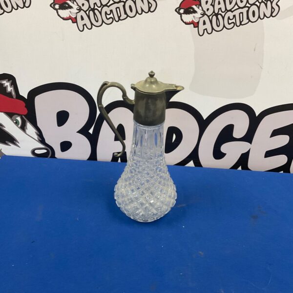 Cut glass claret jug with silverplate collar and scroll handle
