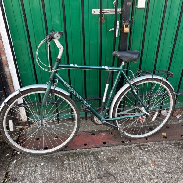 Green Dawes Mojave hybrid bike with rear rack.