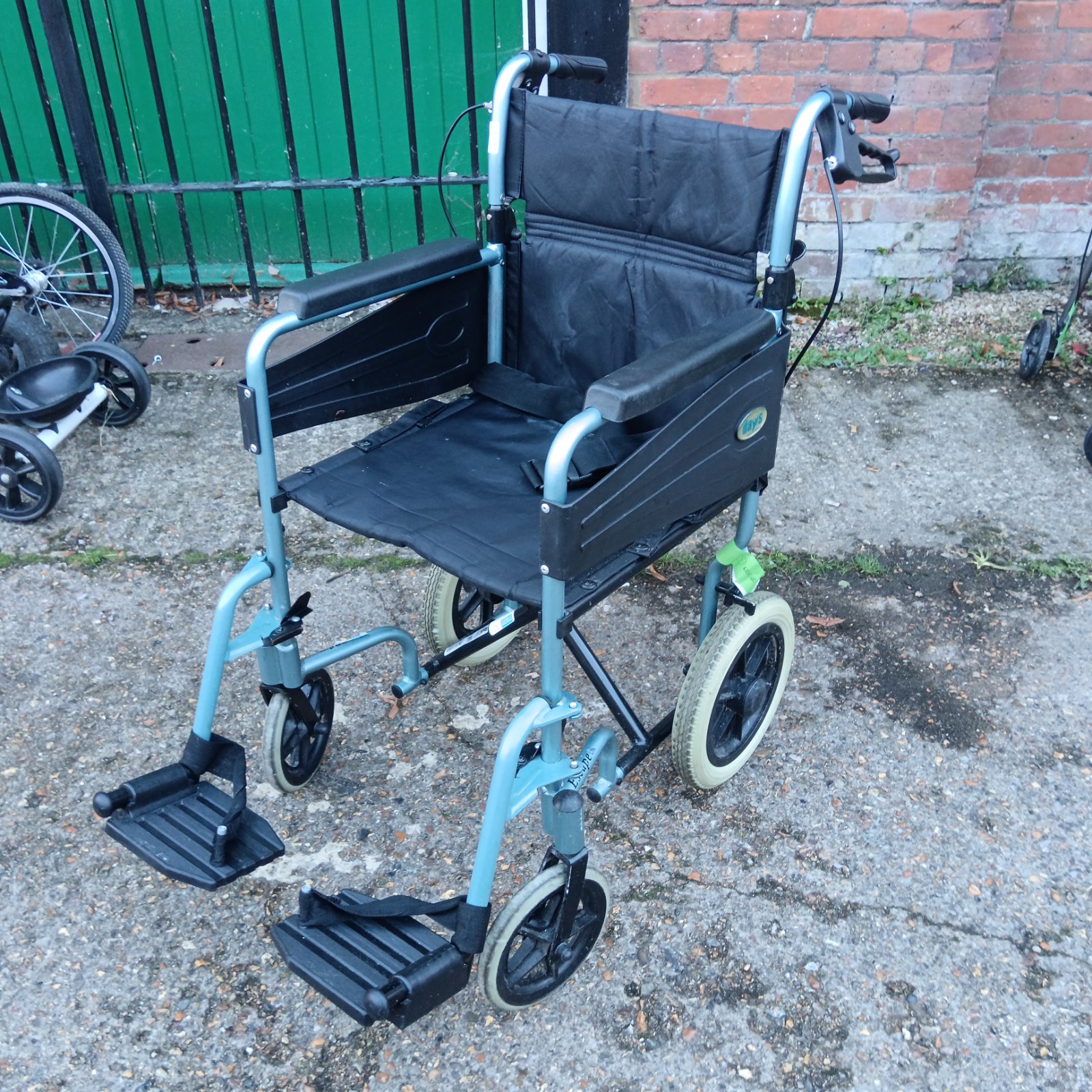 Days folding wheelchair with blue-grey frame and black padded seat