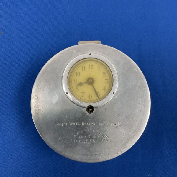 Antique Days Watchman's Tell Tale clock with visible dial and markings.