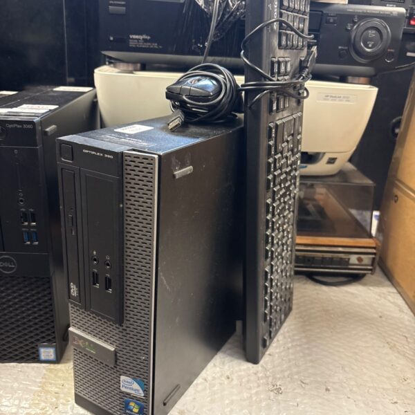 Dell OptiPlex 390 desktop PC tower with keyboard and mouse beside it