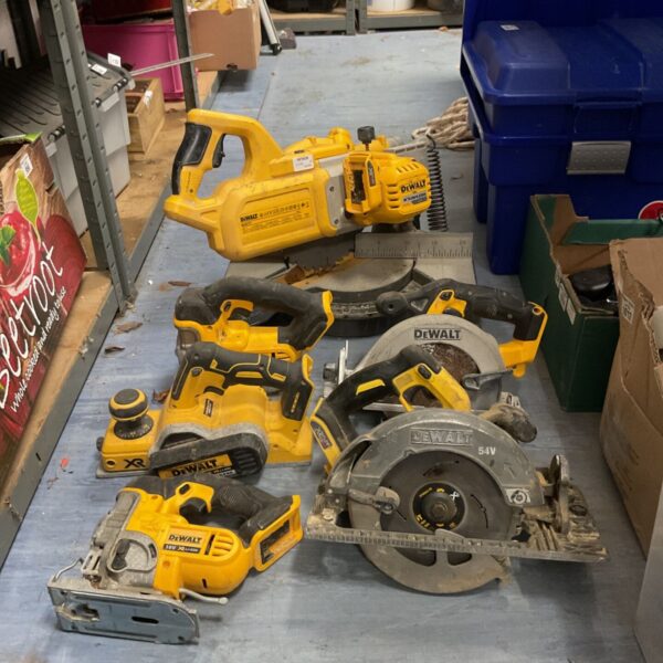 DeWalt cordless power tool bundle including circular saw and planer.