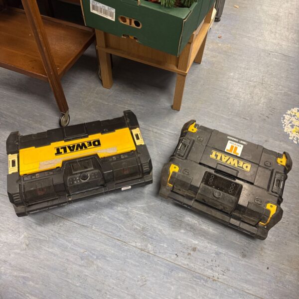 Dewalt 18V site radio pair, one with battery, for jobsite use.
