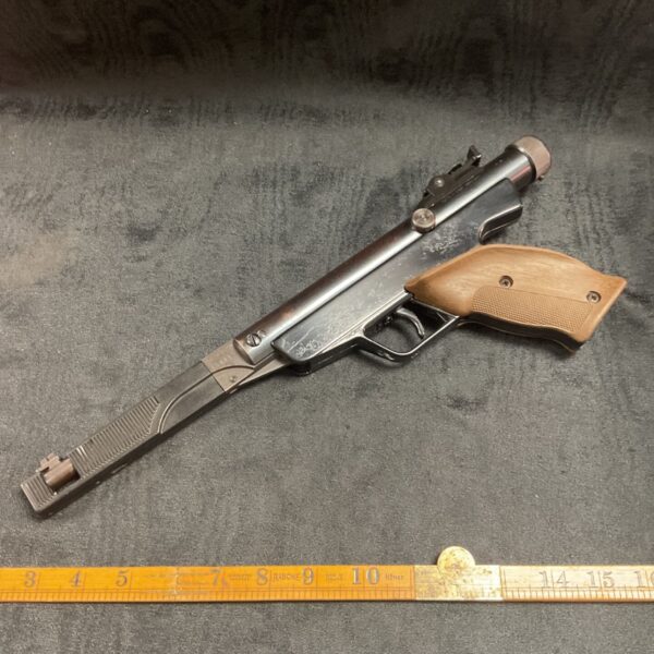 Vintage Diana Model 6M air pistol with scope, side view.