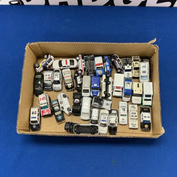 Collection of diecast police cars including Maisto and Welly models.