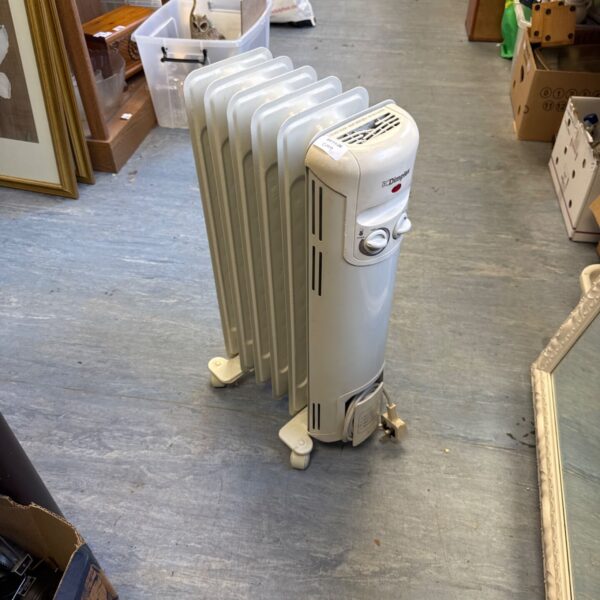 White Dimplex portable oil filled radiator with fins and castor wheels