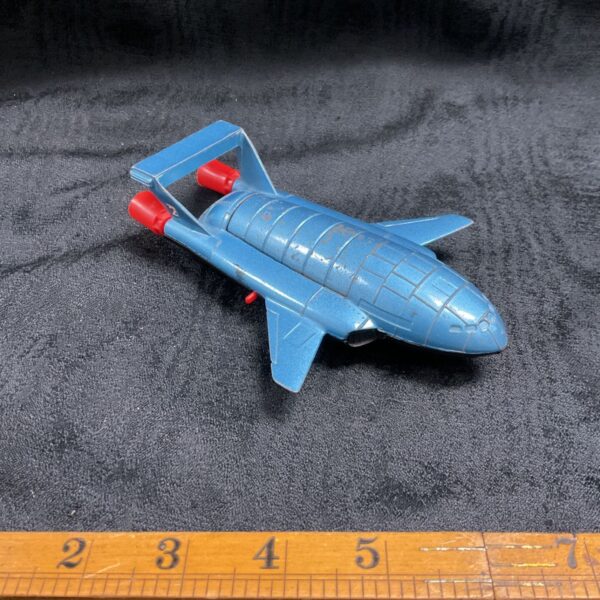Vintage Dinky Thunderbird Two diecast toy, side view.