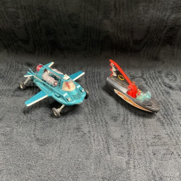 Dinky Toys 102 Joe's Car and Corgi Batman boat with Robin on grey background