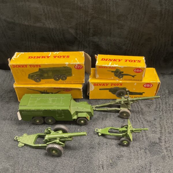 Vintage Dinky Toys military lot with olive green armoured command vehicle and artillery guns