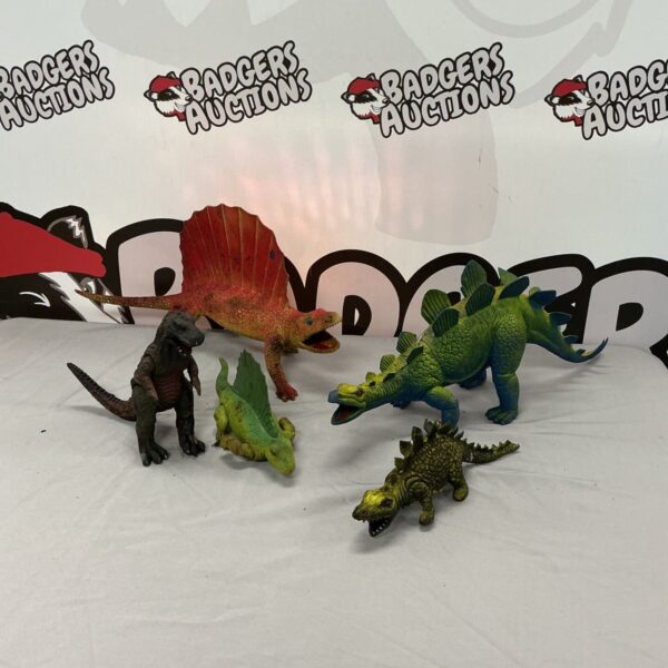 Lot of five plastic dinosaur figures for collectors.