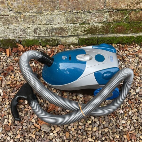 Used Dirt Devil 1200w vacuum cleaner with cylinder design.
